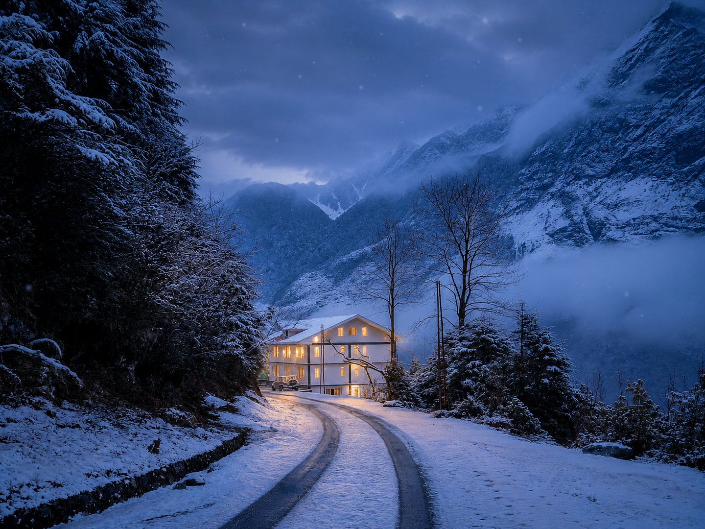 Warm hotel lights at blue hour in snowy Lachung