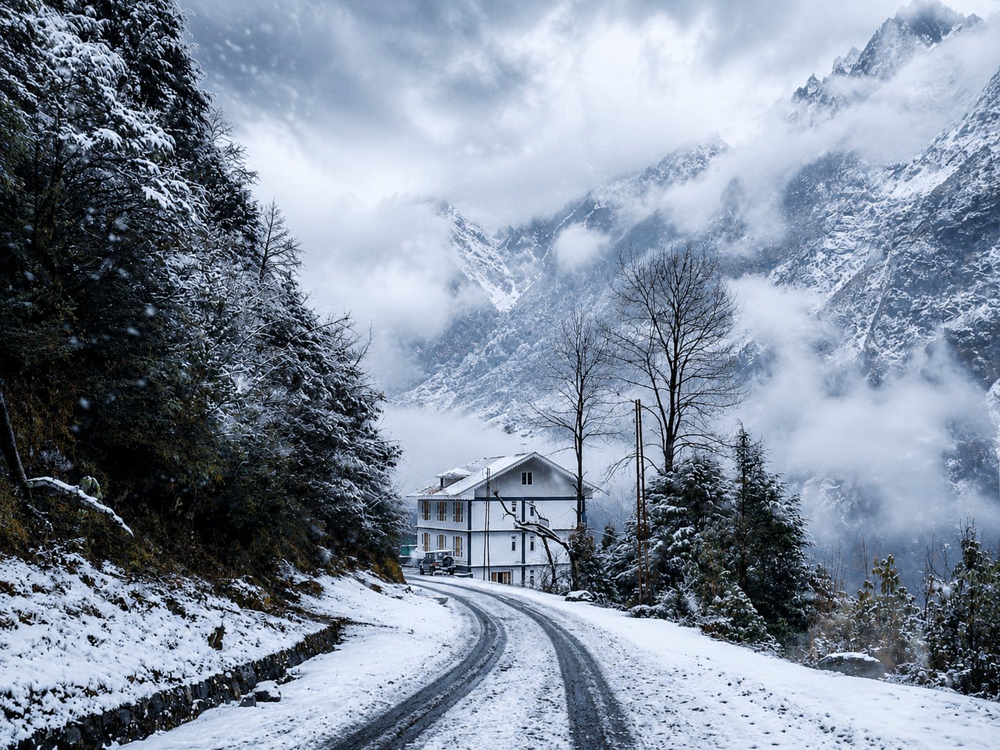 Floret Resort beneath dramatic mist-covered peaks in North Sikkim